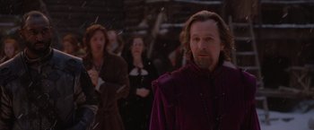 Movie still from “Red Riding Hood” (2011), directed by Catherine Hardwicke – A group of people standing in the snow; Medium shot, Over the shoulder angle