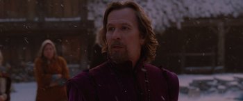 Movie still from “Red Riding Hood” (2011), directed by Catherine Hardwicke – A person with long hair and a beard; Close Up shot, Over the shoulder angle