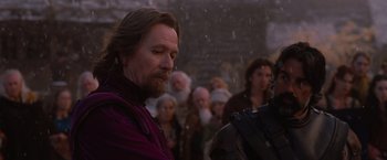 Movie still from “Red Riding Hood” (2011), directed by Catherine Hardwicke – A group of people standing in the snow; Close Up shot, Over the shoulder angle