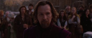 Movie still from “Red Riding Hood” (2011), directed by Catherine Hardwicke – A person with long hair and a beard; Close Up shot, Over the shoulder angle