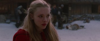 Movie still from “Red Riding Hood” (2011), directed by Catherine Hardwicke – A woman with long blonde hair wearing a red shirt; Close Up shot, Over the shoulder angle