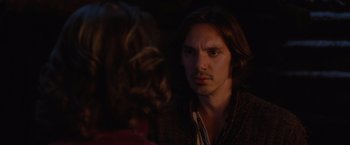 Movie still from “Red Riding Hood” (2011), directed by Catherine Hardwicke – A man and a woman talking in a dark room; Close Up shot, Over the shoulder angle