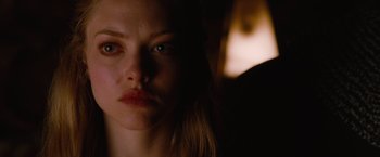 Movie still from “Red Riding Hood” (2011), directed by Catherine Hardwicke – A woman's face in the dark; Close Up shot, Over the shoulder angle