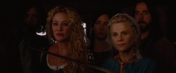 Movie still from “Red Riding Hood” (2011), directed by Catherine Hardwicke – A group of women standing next to each other; Close Up shot, Over the shoulder angle