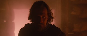 Movie still from “Red Riding Hood” (2011), directed by Catherine Hardwicke – A person with long hair and a beard; Close Up shot, Over the shoulder angle