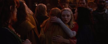 Movie still from “Red Riding Hood” (2011), directed by Catherine Hardwicke – A group of young people hugging each other in a crowd; Close Up shot, Over the shoulder angle