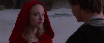 Movie still from “Red Riding Hood” (2011), directed by Catherine Hardwicke – A woman in a red hooded jacket looking at another woman in a red hooded jacket; Close Up shot, Over the shoulder angle
