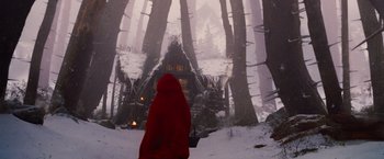 Movie still from “Red Riding Hood” (2011), directed by Catherine Hardwicke – A person wearing a red hooded cape in the snow; Extreme Wide shot, Low angle