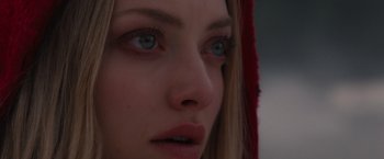 Movie still from “Red Riding Hood” (2011), directed by Catherine Hardwicke – A person with blue eyes; Close Up shot, Over the shoulder angle