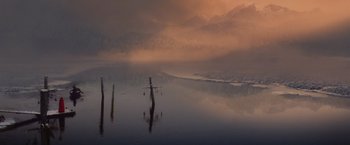 Movie still from “Red Riding Hood” (2011), directed by Catherine Hardwicke – A body of water that has a body of water in the middle of it; Extreme Wide shot, Low angle