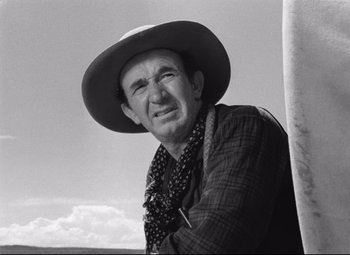 Movie still from “Red River” (1948), directed by Howard Hawks – An older man wearing a cowboy hat and a scarf; Close Up shot, Low angle
