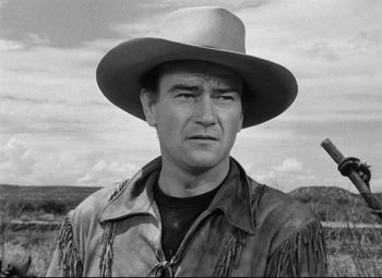 Movie still from “Red River” (1948), directed by Howard Hawks – A man wearing a cowboy hat and a leather jacket; Close Up shot, Low angle