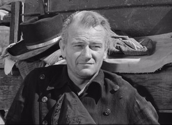 Movie still from “Red River” (1948), directed by Howard Hawks – An older man wearing a jacket and a tie; Close Up shot, Low angle