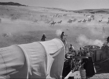 Movie still from “Red River” (1948), directed by Howard Hawks – A black and white photo of men riding horses; Extreme Wide shot, High angle