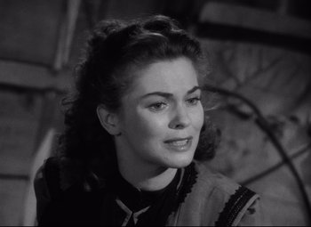 Movie still from “Red River” (1948), directed by Howard Hawks – A black - and - white photo of a woman in a dress; Close Up shot, High angle