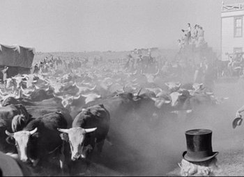 Movie still from “Red River” (1948), directed by Howard Hawks – A large herd of cattle in the middle of a field; Extreme Wide shot, High angle