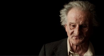 Movie still from “Reds” (1981), directed by Warren Beatty – An old man with a gray hair and a white beard; Close Up shot, Low angle