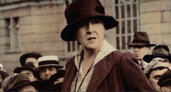 Movie still from “Reds” (1981), directed by Warren Beatty – An old photo of a woman wearing a hat; Close Up shot, Low angle