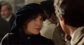 Movie still from “Reds” (1981), directed by Warren Beatty – A person wearing a hat; Close Up shot, Over the shoulder angle