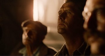 Movie still from “Reds” (1981), directed by Warren Beatty – A man looking up into the sky while another man looks on; Close Up shot, Low angle