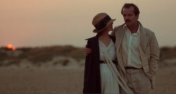Movie still from “Reds” (1981), directed by Warren Beatty – A man and a woman standing next to each other in the desert; Medium shot, Low angle
