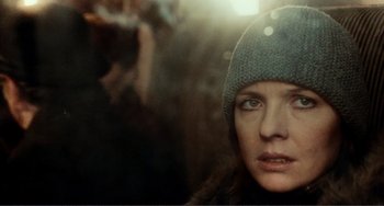 Movie still from “Reds” (1981), directed by Warren Beatty – A person wearing a hat; Close Up shot, Over the shoulder angle