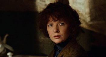 Movie still from “Reds” (1981), directed by Warren Beatty – A person wearing a jacket; Close Up shot, Over the shoulder angle