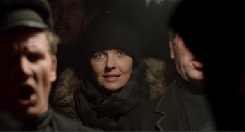 Movie still from “Reds” (1981), directed by Warren Beatty – A person wearing a hat and a scarf; Close Up shot, Over the shoulder angle