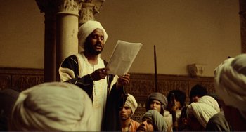 Movie still from “Reds” (1981), directed by Warren Beatty – A group of men standing next to each other in a room; Medium shot, Low angle