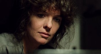Movie still from “Reds” (1981), directed by Warren Beatty – A person with curly hair; Close Up shot, Low angle