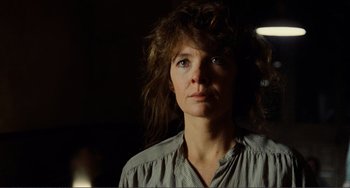 Movie still from “Reds” (1981), directed by Warren Beatty – A person wearing a dress shirt; Close Up shot, Low angle