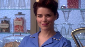 Movie still from “Reefer Madness: The Movie Musical” (2005), directed by Andy Fickman – A person wearing a blue shirt; Close Up shot, Over the shoulder angle