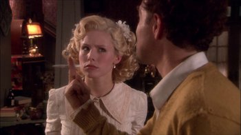 Movie still from “Reefer Madness: The Movie Musical” (2005), directed by Andy Fickman – A man and a woman are looking at each other; Close Up shot, Over the shoulder angle