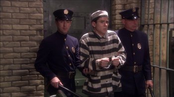 Movie still from “Reefer Madness: The Movie Musical” (2005), directed by Andy Fickman – A group of police officers standing next to each other; Medium shot, High angle