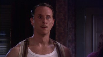 Movie still from “Reefer Madness: The Movie Musical” (2005), directed by Andy Fickman – A person with a mustache; Close Up shot, Low angle