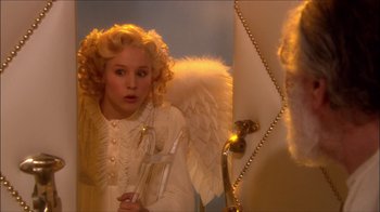Movie still from “Reefer Madness: The Movie Musical” (2005), directed by Andy Fickman – A girl dressed up as an angel holding an instrument; Medium shot, High angle