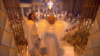 Movie still from “Reefer Madness: The Movie Musical” (2005), directed by Andy Fickman – A couple of people dressed as angels in a room; Extreme Wide shot, High angle