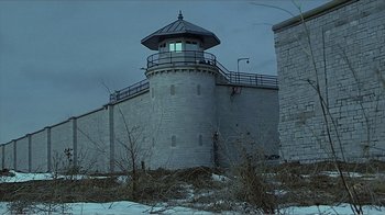 Movie still from “Reindeer Games” (2000), directed by John Frankenheimer – A large building with a tower on the top of it; Extreme Wide shot, Low angle