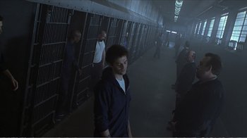 Movie still from “Reindeer Games” (2000), directed by John Frankenheimer – A group of people walking down a dark hallway; Wide shot, High angle