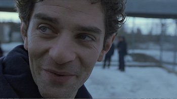 Movie still from “Reindeer Games” (2000), directed by John Frankenheimer – A man's face in the snow; Close Up shot, Over the shoulder angle