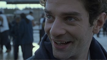 Movie still from “Reindeer Games” (2000), directed by John Frankenheimer – A man smiling for the camera; Close Up shot, Low angle