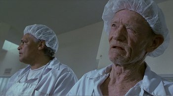 Movie still from “Reindeer Games” (2000), directed by John Frankenheimer – Two men in white shirts and white hats looking at the camera; Close Up shot, Low angle
