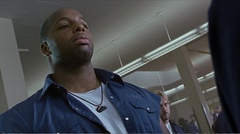 Movie still from “Reindeer Games” (2000), directed by John Frankenheimer – A man in a blue jacket and a man in a white shirt; Close Up shot, Low angle