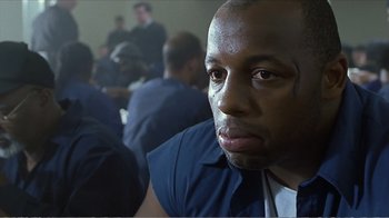 Movie still from “Reindeer Games” (2000), directed by John Frankenheimer – A person wearing a blue shirt; Close Up shot, Low angle