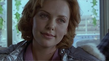 Movie still from “Reindeer Games” (2000), directed by John Frankenheimer – A woman's face in a jacket; Close Up shot, Over the shoulder angle