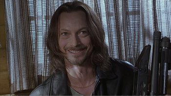 Movie still from “Reindeer Games” (2000), directed by John Frankenheimer – A person wearing a leather jacket; Close Up shot, Over the shoulder angle