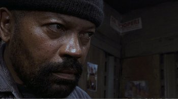 Movie still from “Reindeer Games” (2000), directed by John Frankenheimer – A person wearing a hat; Close Up shot, Low angle