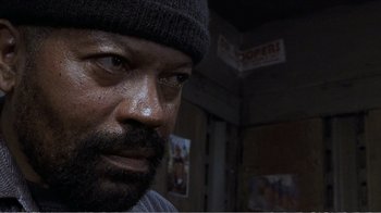 Movie still from “Reindeer Games” (2000), directed by John Frankenheimer – A person wearing a hat; Close Up shot, Low angle