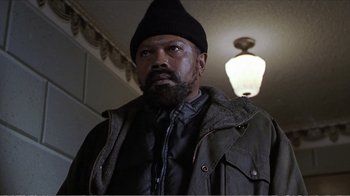 Movie still from “Reindeer Games” (2000), directed by John Frankenheimer – A person with a beard wearing a hat; Close Up shot, Low angle