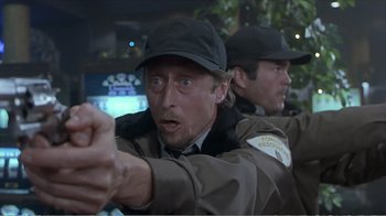 Movie still from “Reindeer Games” (2000), directed by John Frankenheimer – A man in a uniform pointing at the camera; Close Up shot, Over the shoulder angle